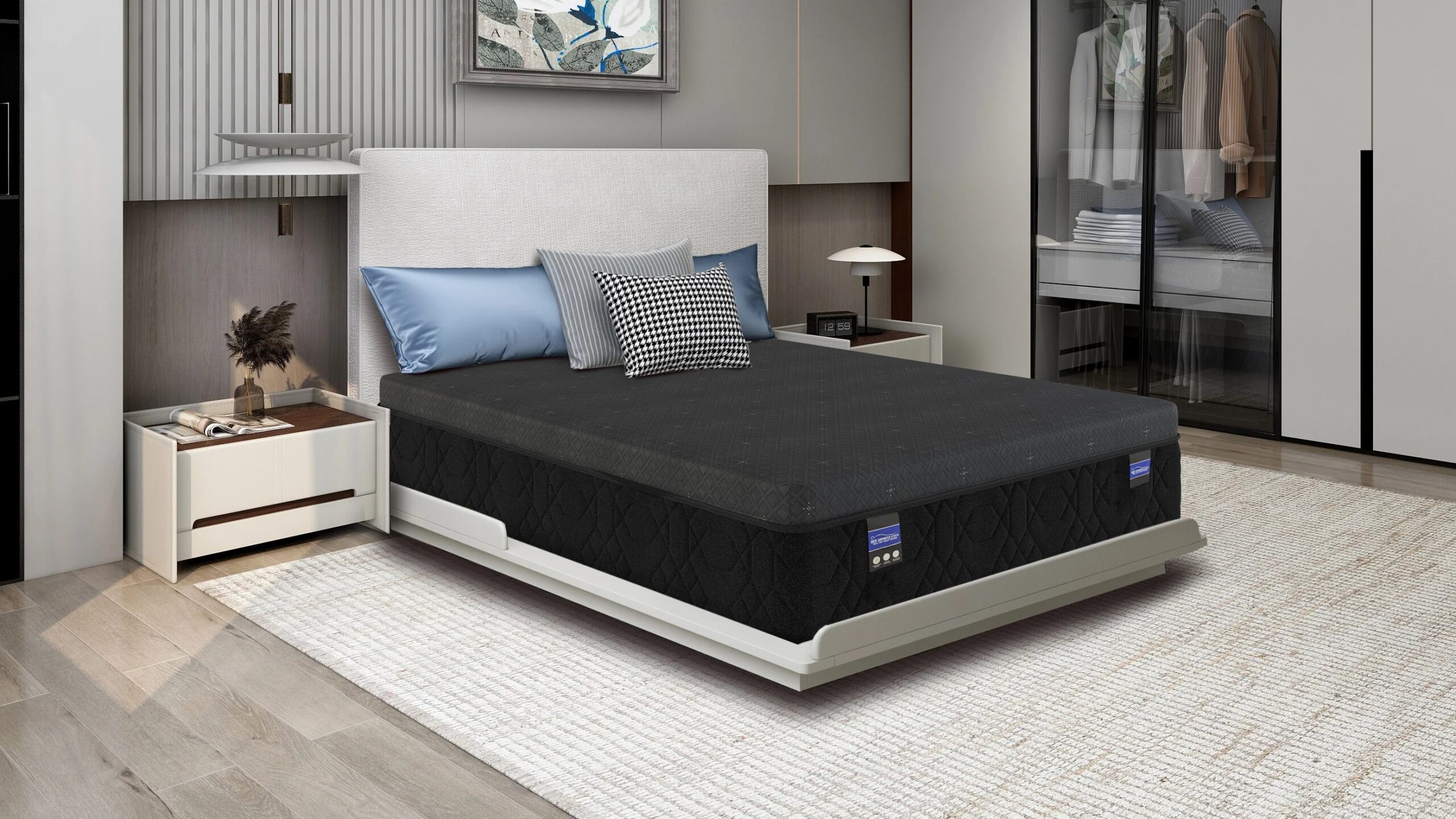 Makayla_Angle_Lifestyle | Carson Mattress Outlet Store Contemporary bedroom with a low white platform bed, gray headboard, blue and patterned pillows, two white nightstands, and a glass-front wardrobe.
